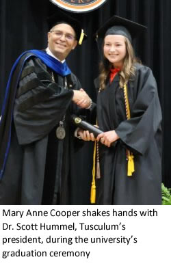 Mary Anne Cooper shakes hands with Dr. Scott Hummel
